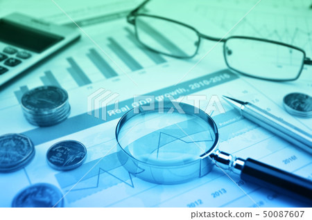 Magnifying glass, pen, coins, calculator and 50087607