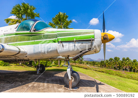 Colorful old airplane at park with gree tree Colorful old airplane at park with gree tree 50089192