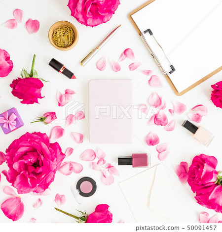 Workspace with clipboard, pastel roses, cosmetics 50091457
