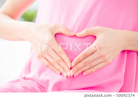 pregnant woman show love gesture pregnant woman show love gesture 50092374