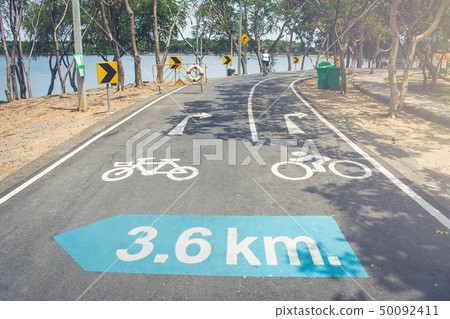 Bicycle lane with traffic signs on road. Bicycle lane with traffic signs on road. 50092411