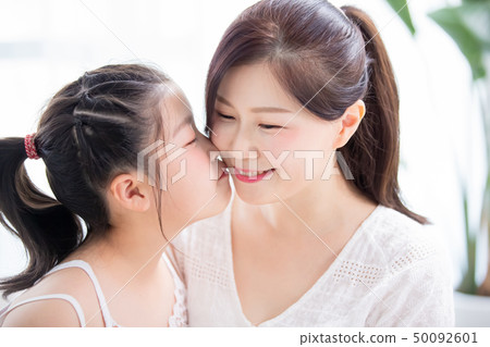 Daughter kiss mom tenderly Daughter kiss mom tenderly 50092601