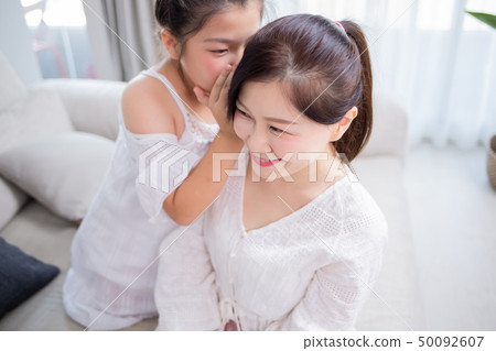 Daughter whisper to mom 50092607