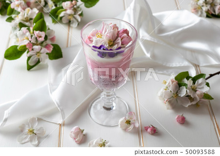 Chia pudding with red currants and apple blossoms 50093588