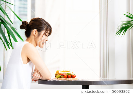 Young woman beauty eating 50093802