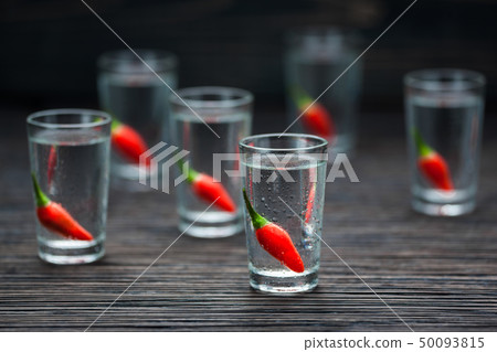 selectiv focus glasses of cold vodka with peppers selectiv focus glasses of cold vodka with peppers 50093815
