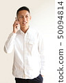 A man who makes a phone call 50094814