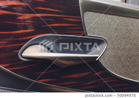 Car inside. Interior of prestige modern car. Climate control, hi-end sound speakers, seat memory Car inside. Interior of prestige modern car. Climate control, hi-end sound speakers, seat memory 50094978