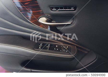 Car inside. Interior of prestige modern car. Climate control, hi-end sound speakers, seat memory Car inside. Interior of prestige modern car. Climate control, hi-end sound speakers, seat memory 50094990