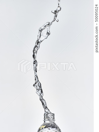 Splashing out of a plastic bottle 50095024