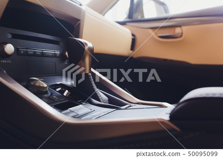 Detail of modern car interior, gear stick, automatic transmission in expensive car. 50095099