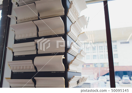 Detail of intricate corner crown molding. a detail of corner ceiling. shop Detail of intricate corner crown molding. a detail of corner ceiling. shop 50095145