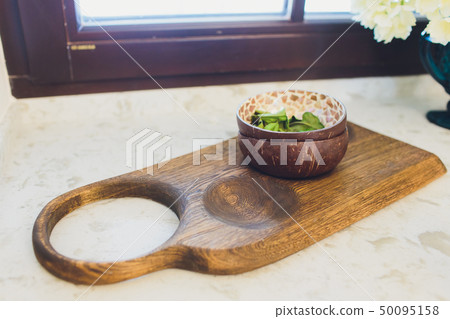 Wooden rustic and vintage crockery, tableware, utensils and stuff on wooden table-top. Kitchen still Wooden rustic and vintage crockery, tableware, utensils and stuff on wooden table-top. Kitchen still 50095158