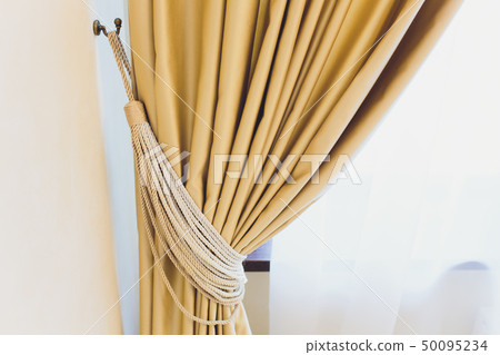 Holder for room curtains. Fragment photo curtain, interior detail, curtain detail close up. 50095234