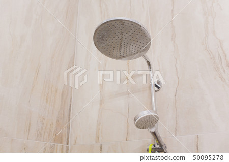 detail of a corner shower cabin with wall mount shower attachment. 50095278