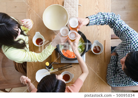 Nabe party toast with beer overhead view 50095834