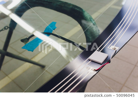 Automobile car windshield or windscreen service concept in auto service station garage. Automobile car windshield or windscreen service concept in auto service station garage. 50096045