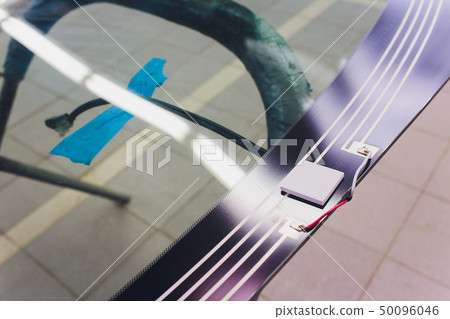 Automobile car windshield or windscreen service concept in auto service station garage. Automobile car windshield or windscreen service concept in auto service station garage. 50096046