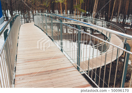 Concret ramp way with stainless steel handrail with disabled sign for support wheelchair disabled 50096170