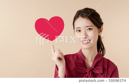 Woman showing heart 50096374