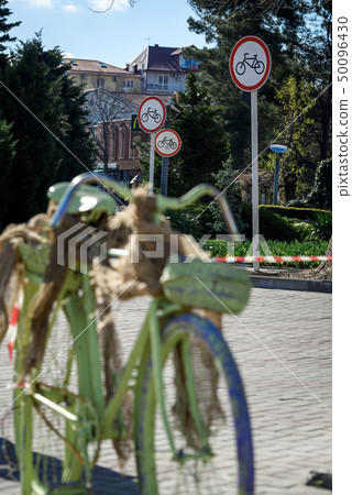 Bicycle and three road signs "closed to bicycles" Bicycle and three road signs "closed to bicycles" 50096430