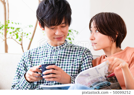 Couple couple relaxing on the couch Couple couple relaxing on the couch 50099252