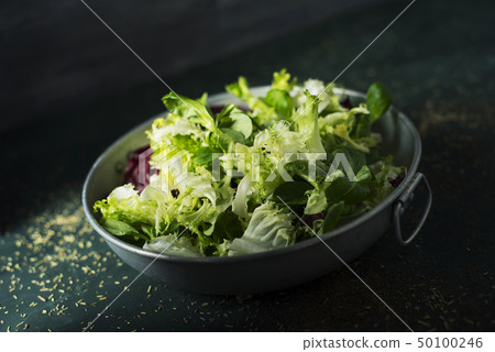 mix of different salad leaves in a metal dish mix of different salad leaves in a metal dish 50100246