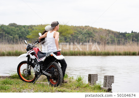 Motorcycle and couple 50104674
