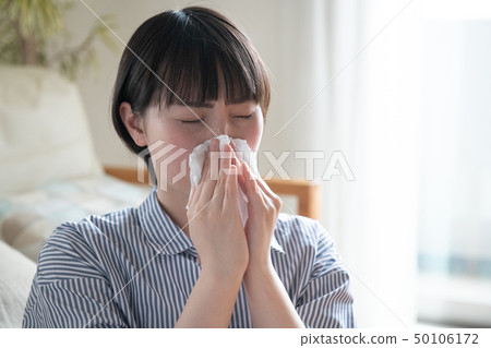 Young Japanese Woman 20s Blowing Nose Young Japanese Woman 20s Blowing Nose 50106172