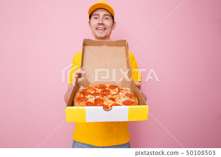 Photo of courier man with pizza box in hands . Photo of courier man with pizza box in hands . 50108503