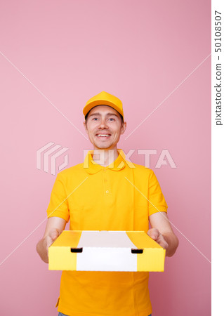 Photo of courier man with pizza box in hands . 50108507