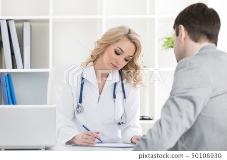 Doctor with patient 50108930