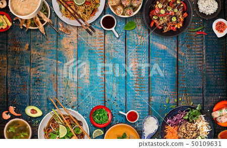 Asian food background with various ingredients on rustic wooden table , top view. 50109631
