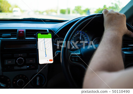 male driving a car on the road using a new, concept of traveling by car, gps. 50110490