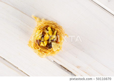 Lebanese baklava nest on grey wood Lebanese baklava nest on grey wood 50110870