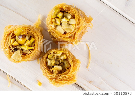 Lebanese baklava nest on grey wood 50110873