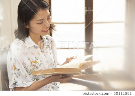 Lifestyle young woman reading used book relax Lifestyle young woman reading used book relax 50111891