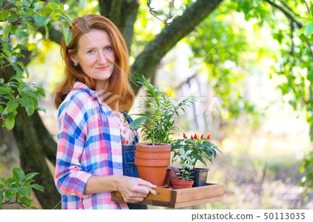 girl plants a plant girl plants a plant 50113035