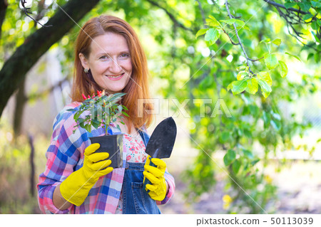 girl plants a plant girl plants a plant 50113039