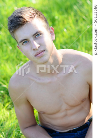 shirtless male on grass 50113566