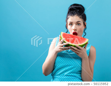 Young woman holding watermelon Young woman holding watermelon 50115952