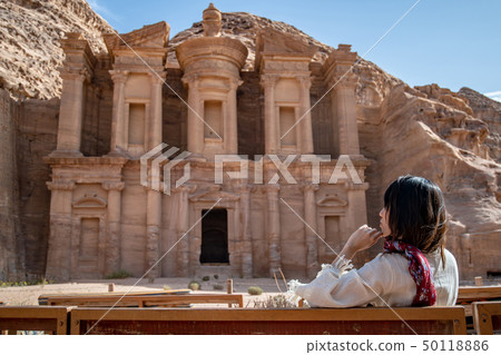 Asian woman tourist sitting in Petra, Jordan Asian woman tourist sitting in Petra, Jordan 50118886
