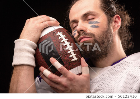 Close up portrait of American Football Player with ball 50122410