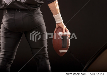 Cropped Image Of Sportsman Holding American Football Ball 50122451