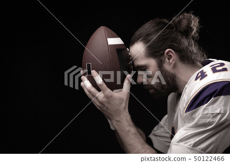 Close up portrait of American Football Player with ball 50122466