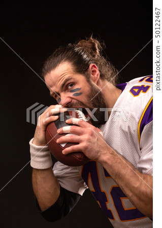 Close up portrait of aggressive American Football Player 50122467