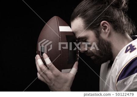 Close up portrait of American Football Player with ball Close up portrait of American Football Player with ball 50122479