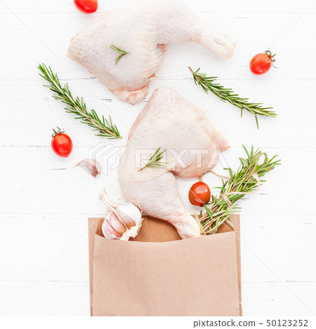 Fresh raw chicken legs with herbs. Cooking concept 50123252
