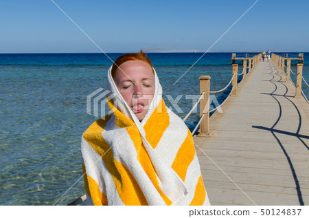 Young woman in towel Young woman in towel 50124837