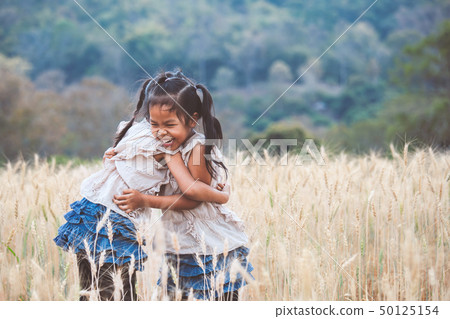 Two asian girls hugging each other with love 50125154
